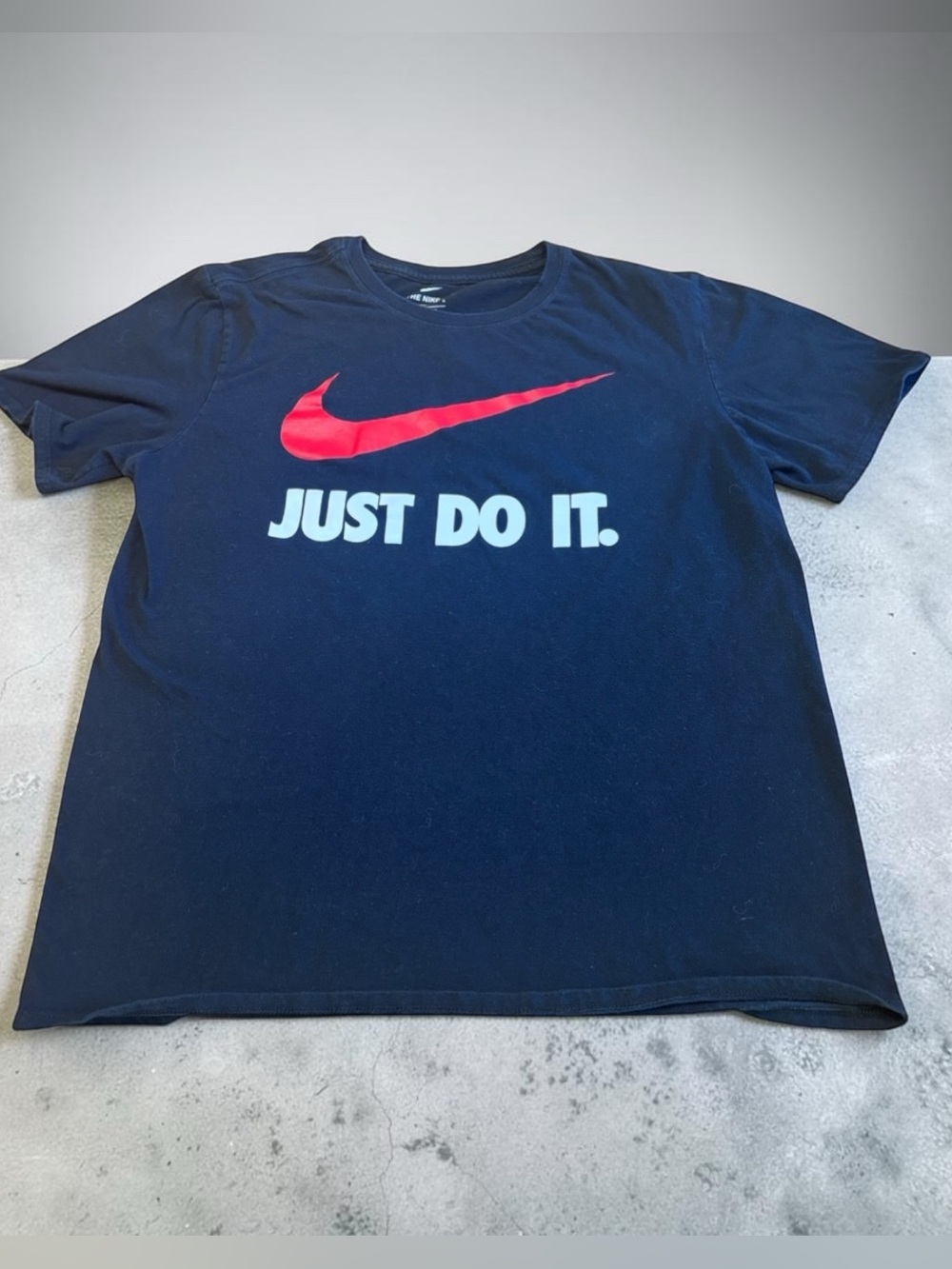 Nike Unisex Black Short Sleeve Tee with Red Swoosh and White "Just Do It."